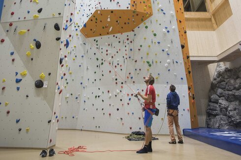 In sport climbing, the lower climber belays his partner on the wall. 
