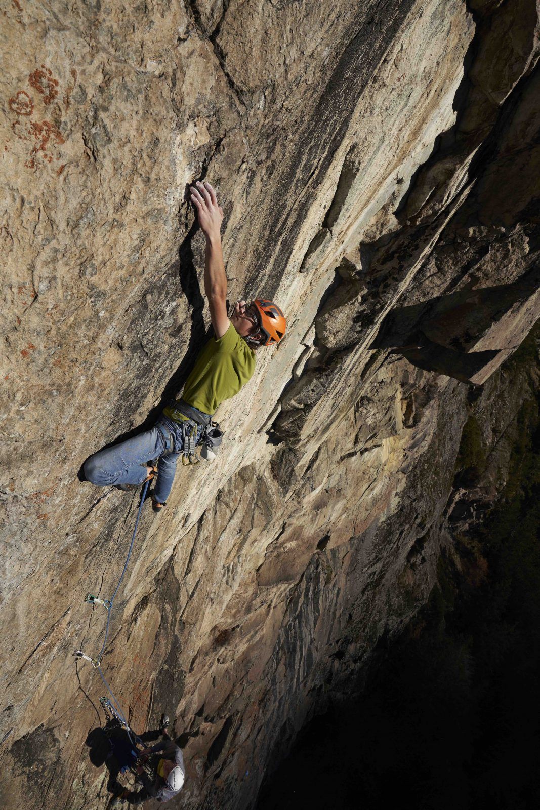 Leo Moser climbing dynamically on the crux pitch of ‘Boulevard of Broken Dreams’