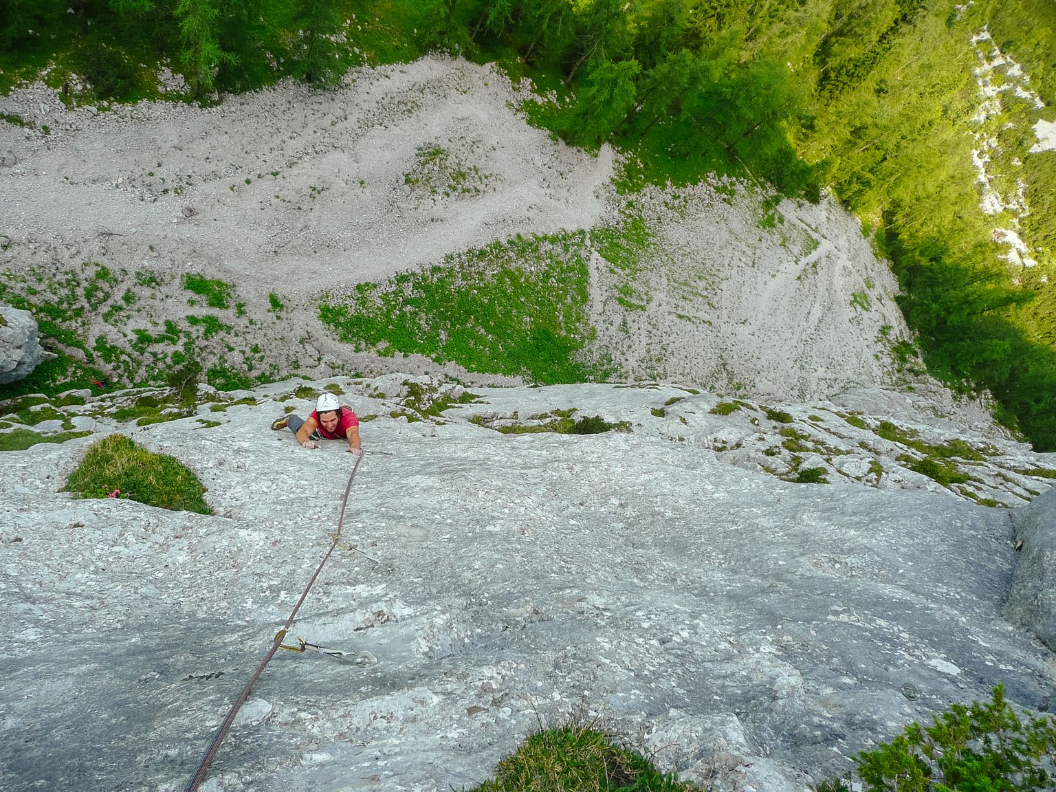 Climber on a technical slab at the Wampeten Schrofen
