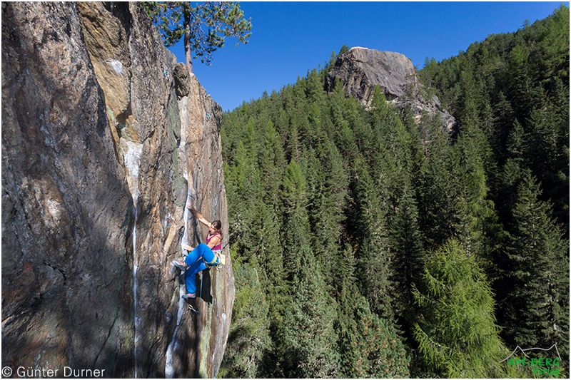 A female climber on a Rock Face, example image from a climbing guidebook