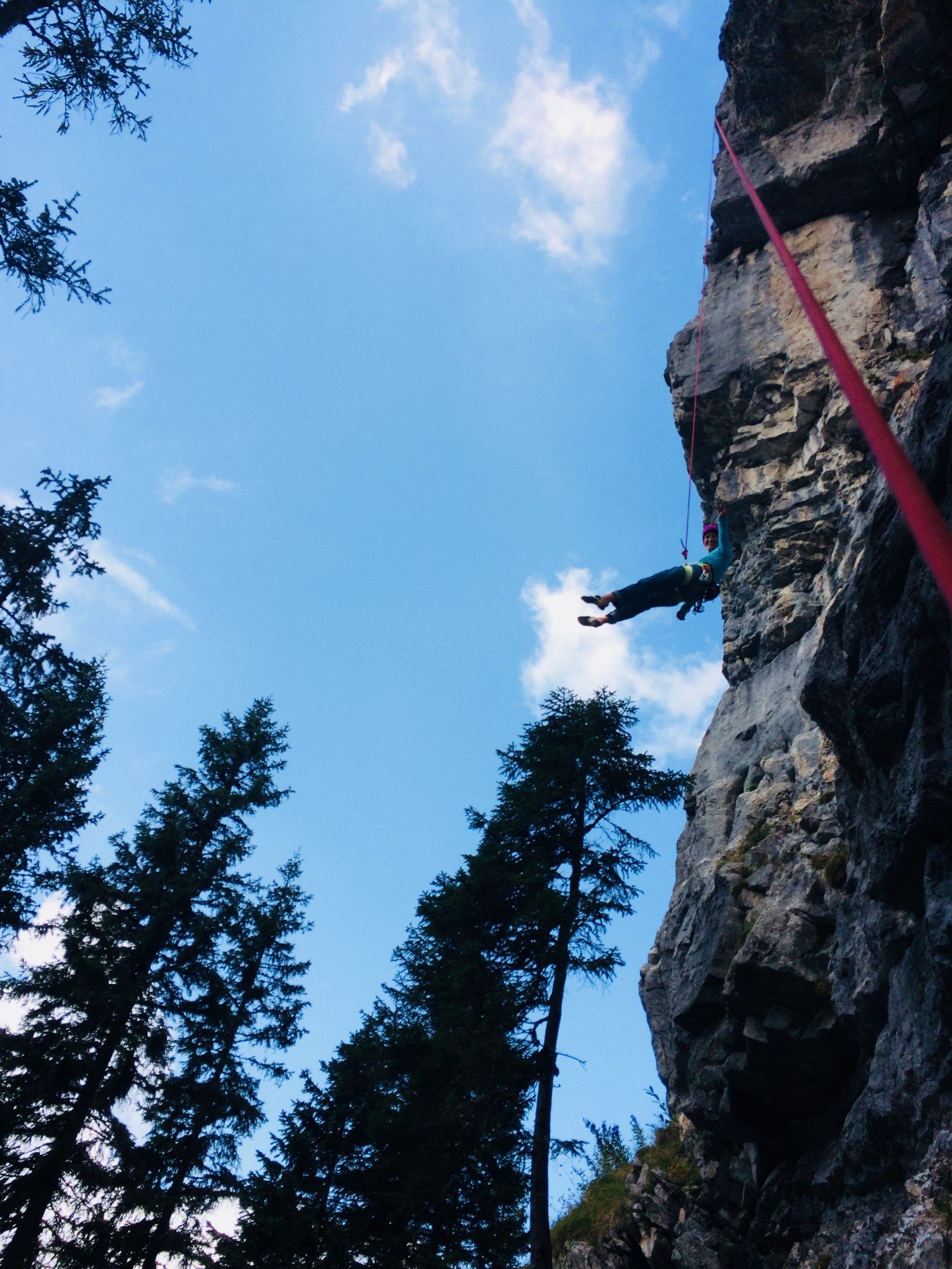 A female climber in the rear sector of the ‘Kanzel’ Crag in the Tannheimer Valley