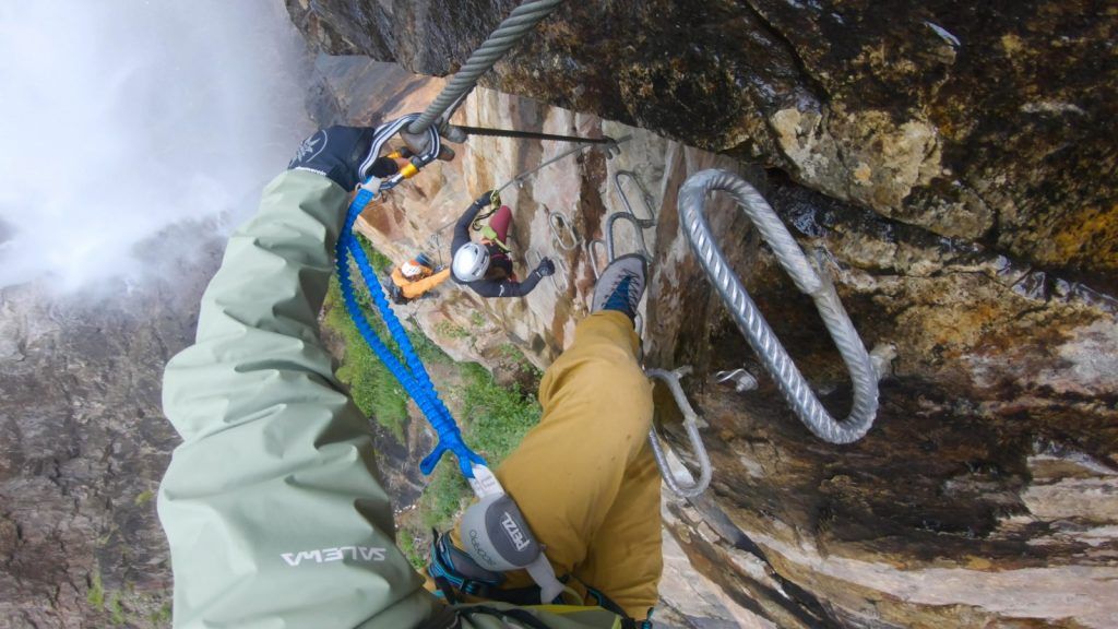 Via ferrata climbers on a steep section of a sport via ferrata