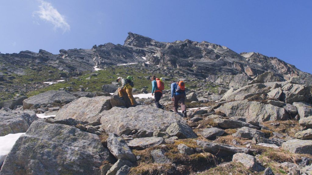 Via Ferrata/Iron Way climbers on the access to an alpine Via Ferrata/Iron Way