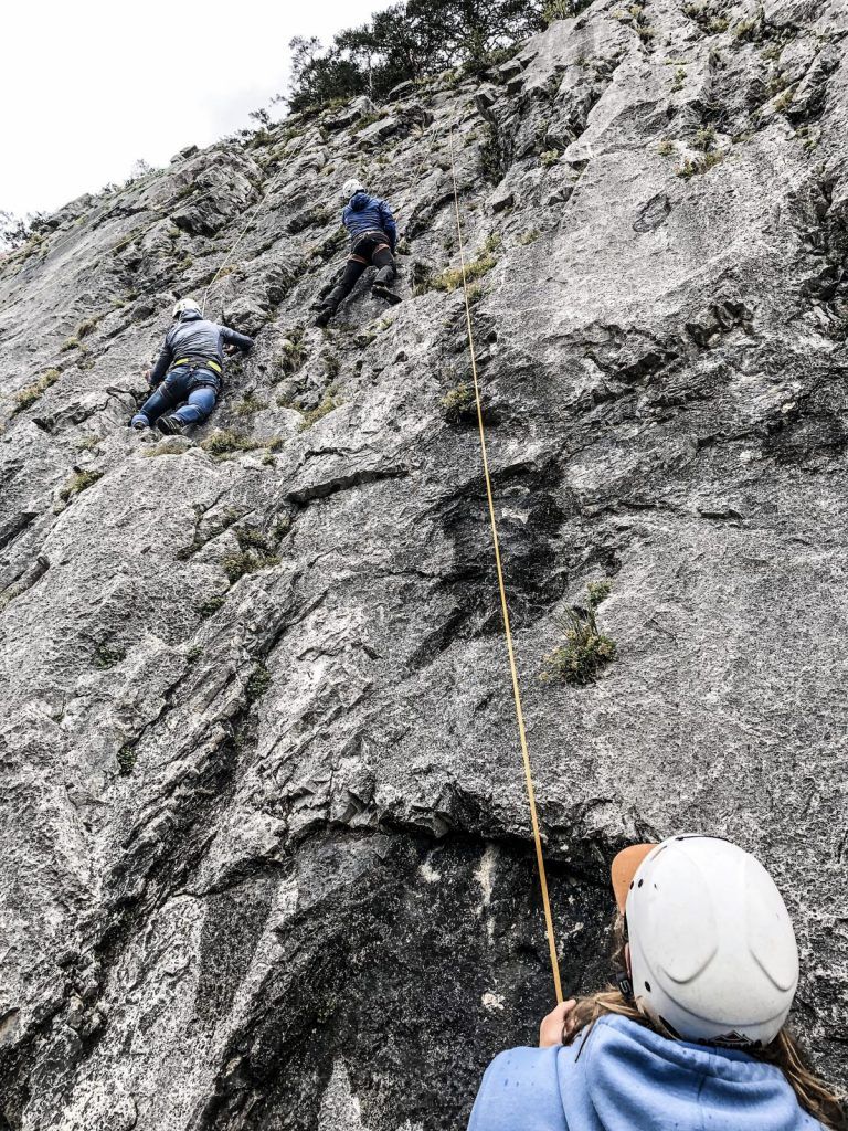 A female climber on a route at the Sonnenplatten Rock Climbing Area in Scharnitz