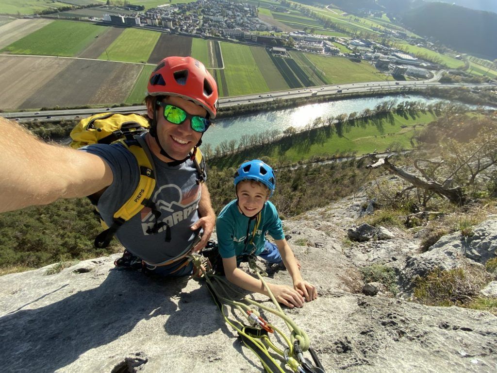 Child climbing on the rock face