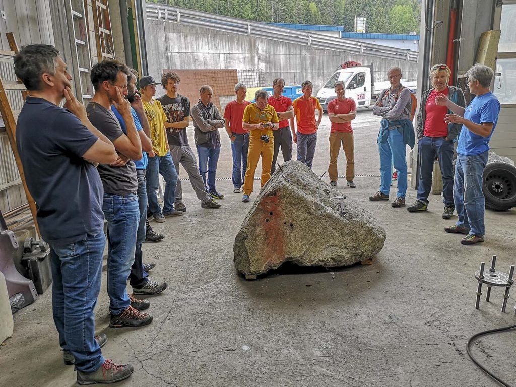 Participants on a rock drilling course for route-setters